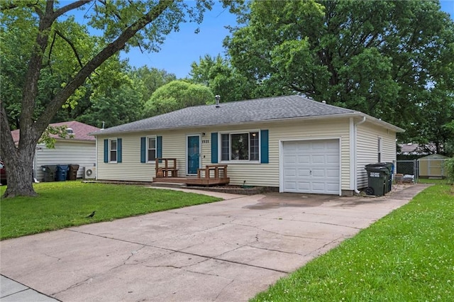 1521 W 22nd St, Lawrence, KS 66046 - ranch-style house with a garage, concrete driveway, and a gate