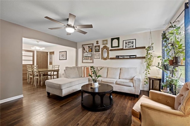 1521 W 22nd St, Lawrence, KS 66046 - living room featuring ceiling fan, wood finished floors, and a chandelier