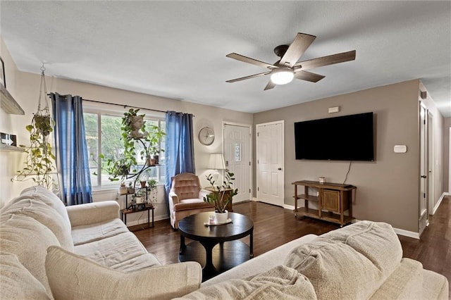 1521 W 22nd St, Lawrence, KS 66046 - living area featuring ceiling fan and dark wood finished floors