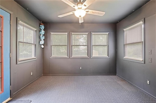 1521 W 22nd St, Lawrence, KS 66046 - carpeted spare room with plenty of natural light and a ceiling fan