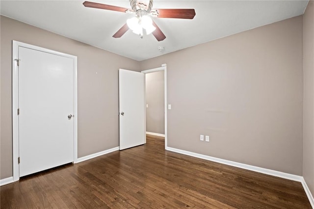 1521 W 22nd St, Lawrence, KS 66046 - unfurnished bedroom featuring wood finished floors and ceiling fan