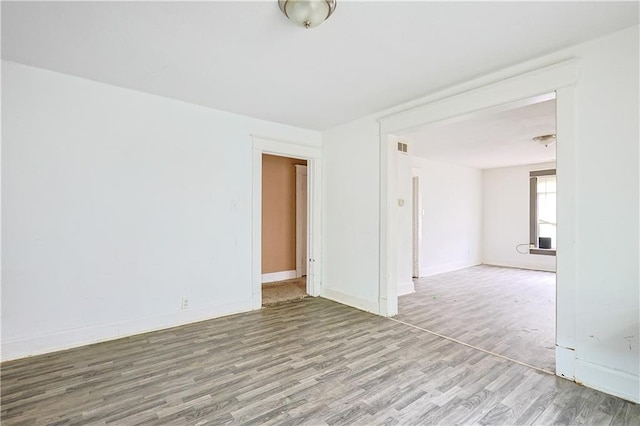 2512 Jules St, Saint Joseph, MO 64501 - empty room with wood finished floors and baseboards