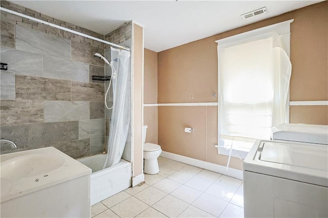 2512 Jules St, Saint Joseph, MO 64501 - full bathroom featuring washer / dryer, tile patterned floors, shower / bath combination with curtain, and vanity