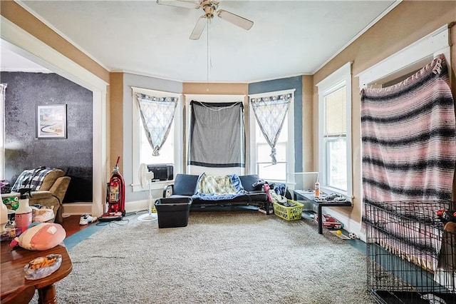 2512 Jules St, Saint Joseph, MO 64501 - living area featuring ornamental molding, ceiling fan, plenty of natural light, carpet floors, and cooling unit