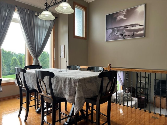 938 S 17th St, Leavenworth, KS 66048 - dining space featuring wood finished floors and healthy amount of natural light