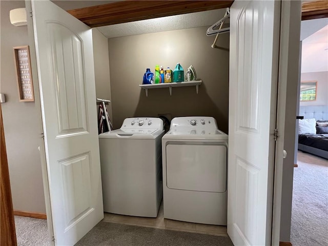 938 S 17th St, Leavenworth, KS 66048 - laundry area featuring washer and dryer and carpet flooring