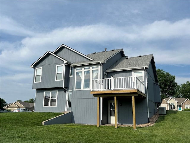 938 S 17th St, Leavenworth, KS 66048 - back of property with a wooden deck, a lawn, and a shingled roof