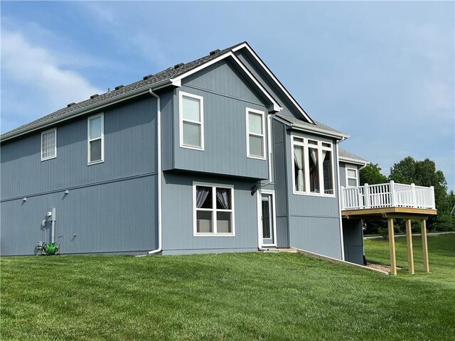 938 S 17th St, Leavenworth, KS 66048 - back of house with a wooden deck and a lawn