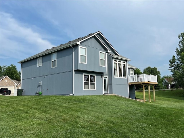 938 S 17th St, Leavenworth, KS 66048 - rear view of property featuring a wooden deck and a lawn
