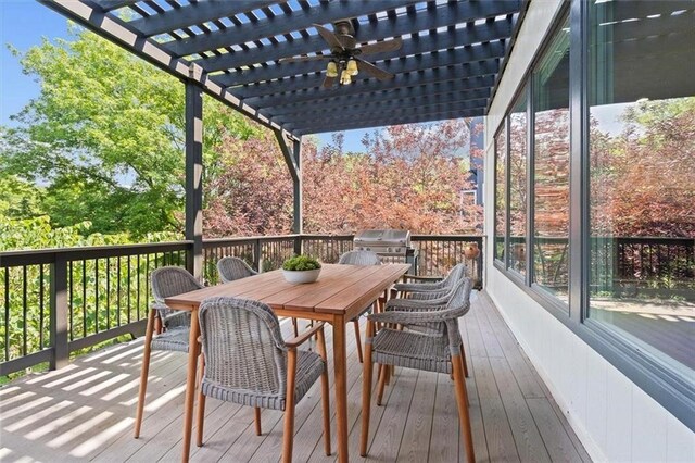 18970 W 115th Ter, Olathe, KS 66061 - wooden terrace with outdoor dining area, a pergola, ceiling fan, and area for grilling