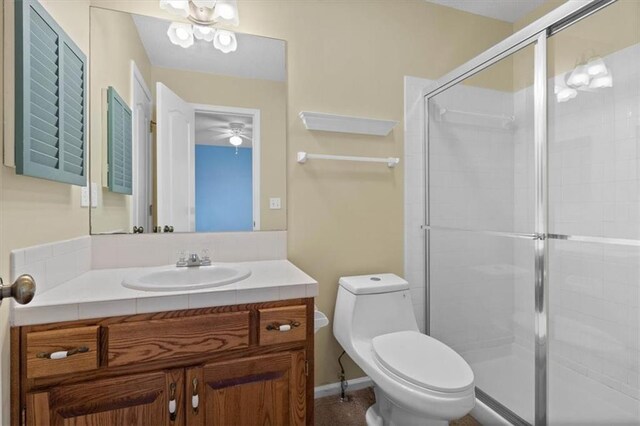 18970 W 115th Ter, Olathe, KS 66061 - bathroom with vanity, a stall shower, and a ceiling fan