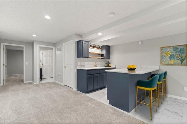 18970 W 115th Ter, Olathe, KS 66061 - kitchen with a kitchen breakfast bar, recessed lighting, open shelves, light countertops, and light marble finish flooring