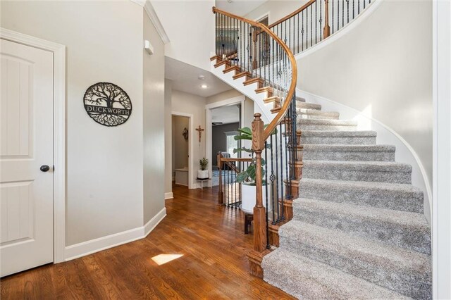 936 SW Raintree Dr, Lees Summit, MO 64082 - stairs featuring wood finished floors and a towering ceiling