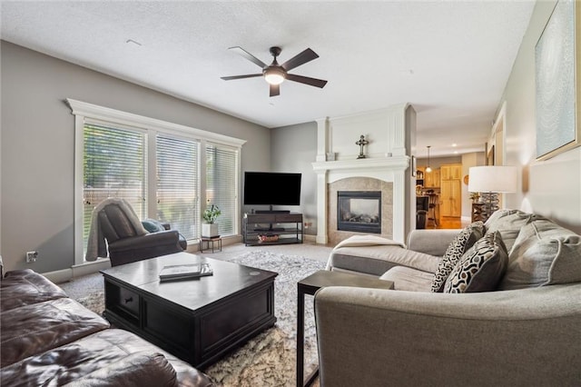 936 SW Raintree Dr, Lees Summit, MO 64082 - carpeted living room featuring ceiling fan and a tiled fireplace
