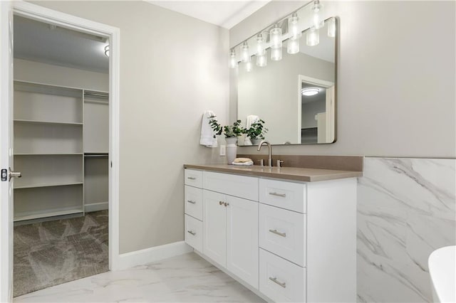 14600 Reinhardt Ln, Leawood, KS 66224 - full bath featuring vanity, marble finish floors, and a walk in closet