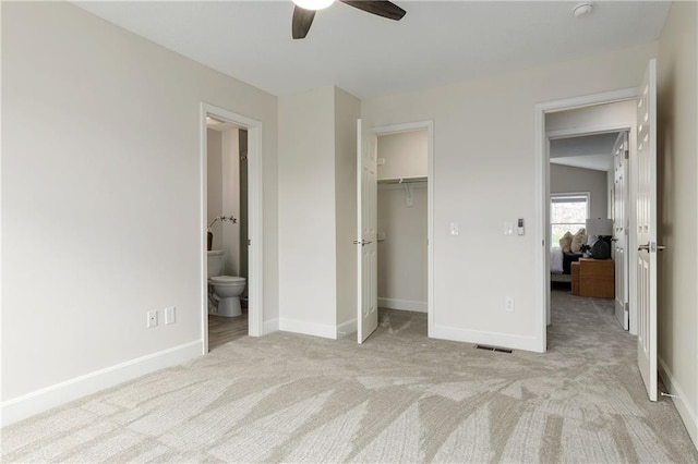 14600 Reinhardt Ln, Leawood, KS 66224 - unfurnished bedroom with carpet floors, connected bathroom, a closet, and ceiling fan