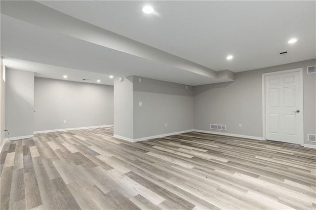 14600 Reinhardt Ln, Leawood, KS 66224 - finished below grade area with light wood-style flooring and recessed lighting