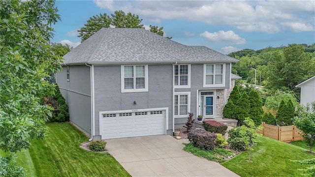 5303 Hallet St, Shawnee, KS 66216 - traditional-style house with an attached garage, a front lawn, stucco siding, and driveway