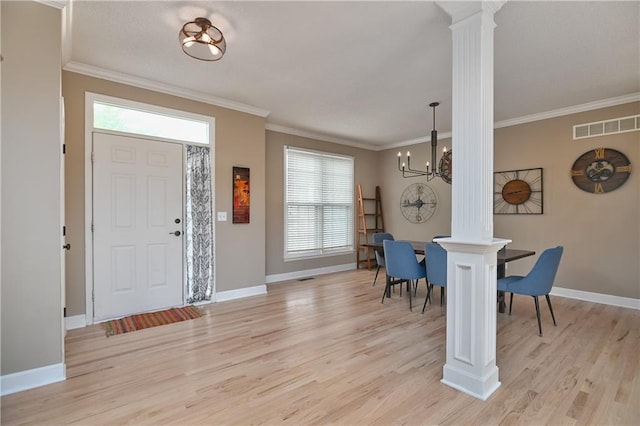 5303 Hallet St, Shawnee, KS 66216 - entrance foyer featuring ornate columns, a chandelier, light wood-type flooring, plenty of natural light, and crown molding