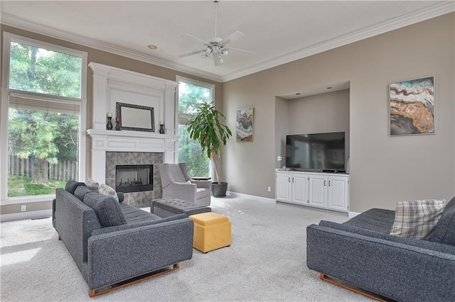 5303 Hallet St, Shawnee, KS 66216 - living room with carpet floors, crown molding, ceiling fan, and a tile fireplace