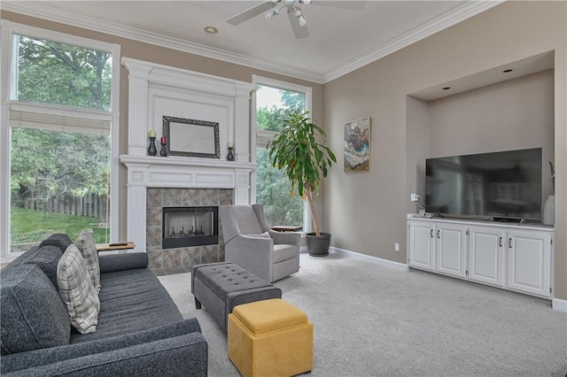 5303 Hallet St, Shawnee, KS 66216 - living area featuring crown molding, ceiling fan, a fireplace, and carpet floors