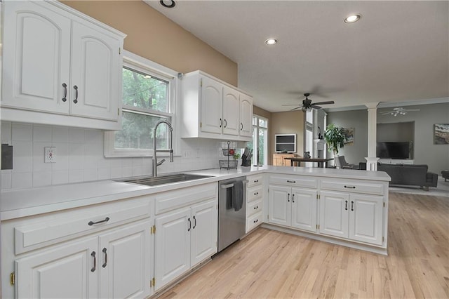 5303 Hallet St, Shawnee, KS 66216 - kitchen featuring stainless steel dishwasher, ceiling fan, a peninsula, light countertops, and decorative backsplash