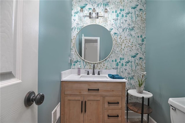 5303 Hallet St, Shawnee, KS 66216 - bathroom with vanity and wallpapered walls
