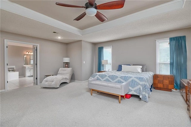 5303 Hallet St, Shawnee, KS 66216 - carpeted bedroom featuring ornamental molding, ensuite bathroom, a tray ceiling, and ceiling fan