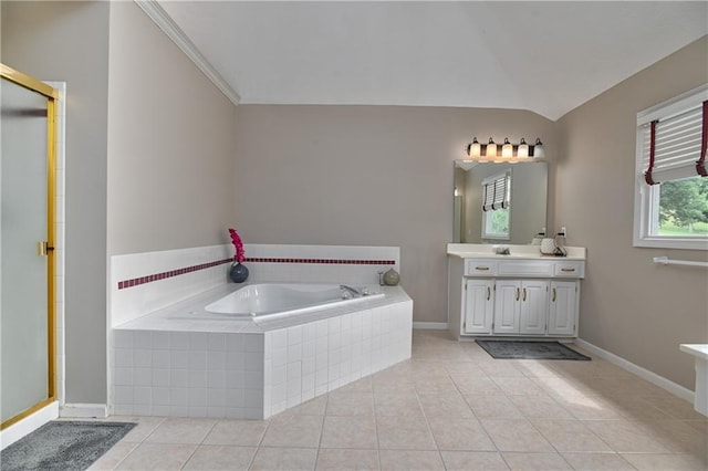 5303 Hallet St, Shawnee, KS 66216 - bathroom featuring vanity, a garden tub, vaulted ceiling, tile patterned flooring, and a stall shower