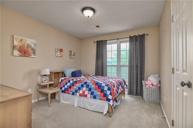 5303 Hallet St, Shawnee, KS 66216 - carpeted bedroom featuring a textured ceiling and baseboards