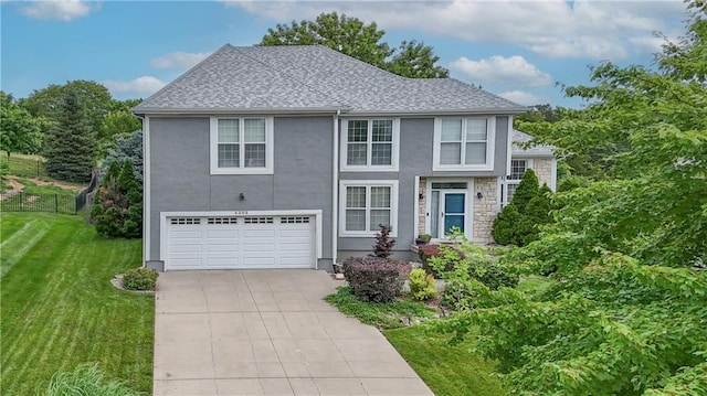 5303 Hallet St, Shawnee, KS 66216 - view of front facade featuring an attached garage, stucco siding, driveway, and a shingled roof