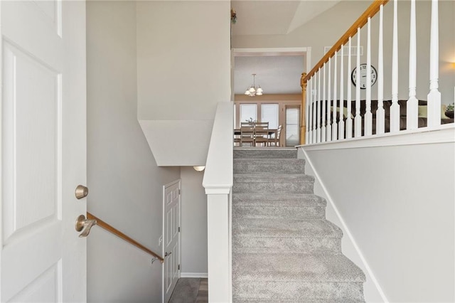 103 Bridgeport Dr, Smithville, MO 64089 - staircase with a chandelier and baseboards