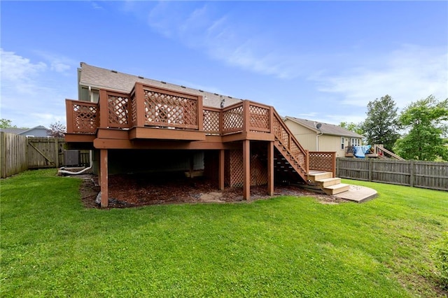 103 Bridgeport Dr, Smithville, MO 64089 - rear view of property with a fenced backyard, a wooden deck, and stairs