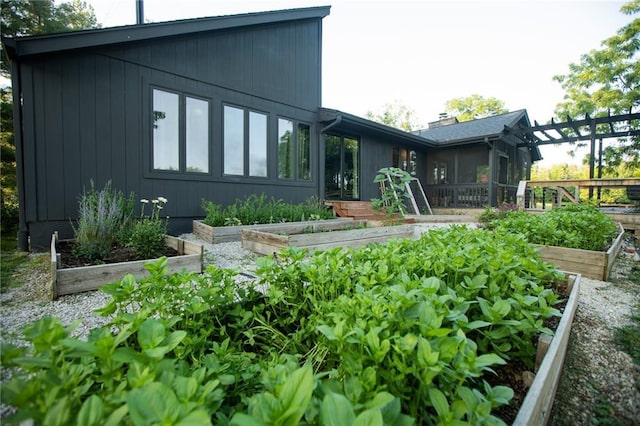 11001 S Perdue Rd, Grain Valley, MO 64029 - back of house with a garden and a sunroom