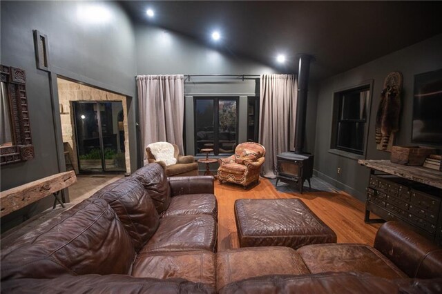 11001 S Perdue Rd, Grain Valley, MO 64029 - cinema with a wood stove, wood finished floors, and recessed lighting