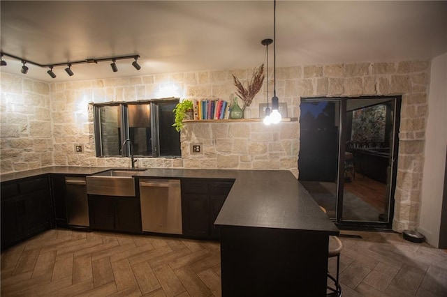 11001 S Perdue Rd, Grain Valley, MO 64029 - kitchen with dishwasher, a kitchen bar, pendant lighting, a peninsula, and rail lighting