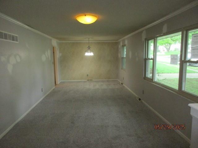 19005 E 18th Ter N, Independence, MO 64058 - spare room featuring crown molding, carpet, and baseboards
