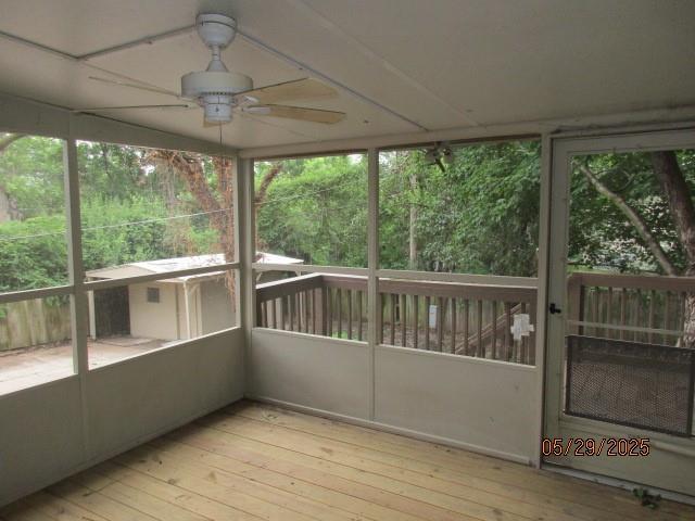 19005 E 18th Ter N, Independence, MO 64058 - unfurnished sunroom with ceiling fan