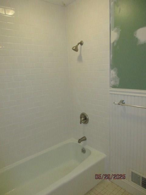 19005 E 18th Ter N, Independence, MO 64058 - bathroom featuring wainscoting and  shower combination