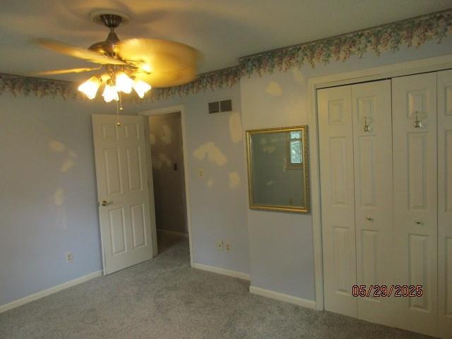 19005 E 18th Ter N, Independence, MO 64058 - unfurnished bedroom featuring carpet, a closet, baseboards, and ceiling fan