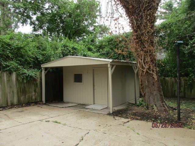 19005 E 18th Ter N, Independence, MO 64058 - view of outbuilding with a carport and concrete driveway