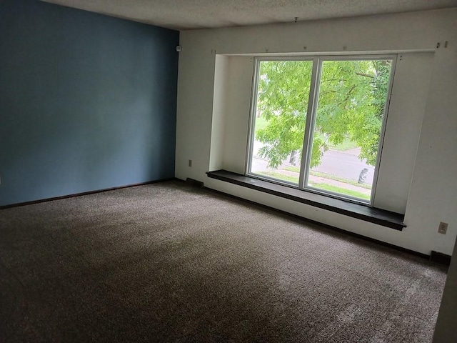 2912 Iva Dr, Independence, MO 64057 - carpeted empty room with a textured ceiling