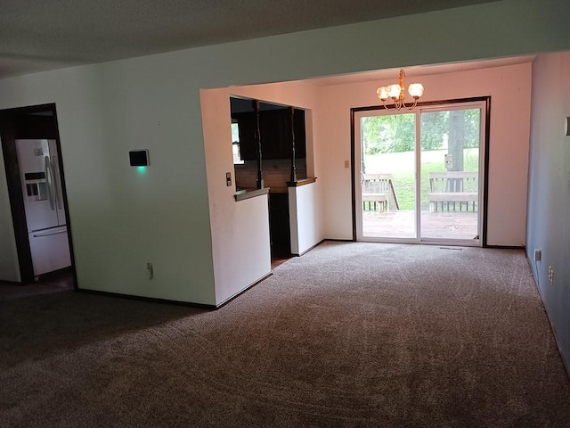 2912 Iva Dr, Independence, MO 64057 - unfurnished living room with carpet floors, a chandelier, and baseboards