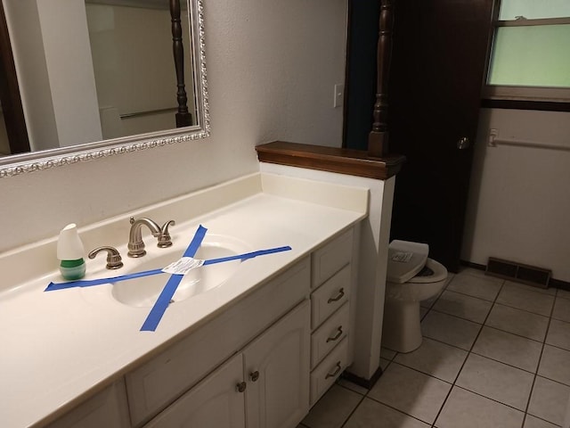 2912 Iva Dr, Independence, MO 64057 - bathroom featuring vanity, toilet, and tile patterned floors