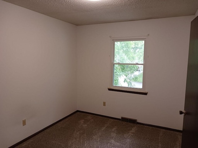 2912 Iva Dr, Independence, MO 64057 - carpeted spare room featuring baseboards and a textured ceiling