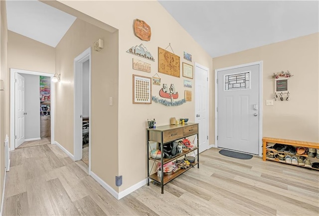 1112 Anderson St, Warrensburg, MO 64093 - foyer entrance featuring light wood-style floors and vaulted ceiling