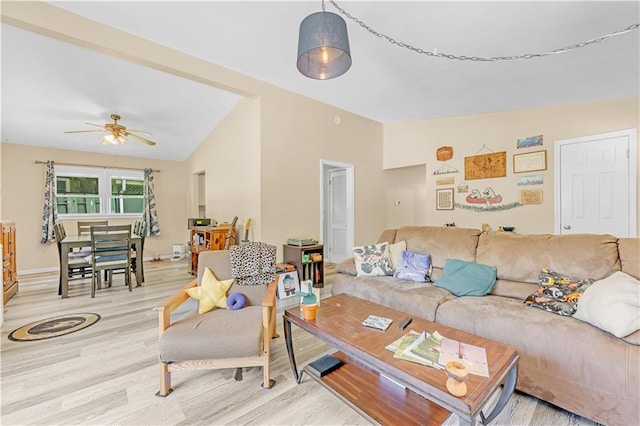 1112 Anderson St, Warrensburg, MO 64093 - living area with light wood-style floors, a ceiling fan, and lofted ceiling