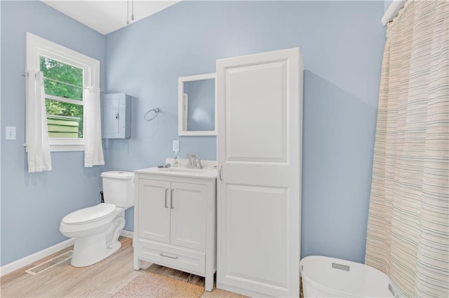 1112 Anderson St, Warrensburg, MO 64093 - bathroom with wood finished floors and vanity