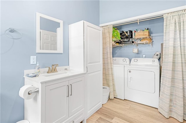 1112 Anderson St, Warrensburg, MO 64093 - washroom featuring independent washer and dryer and light wood-type flooring