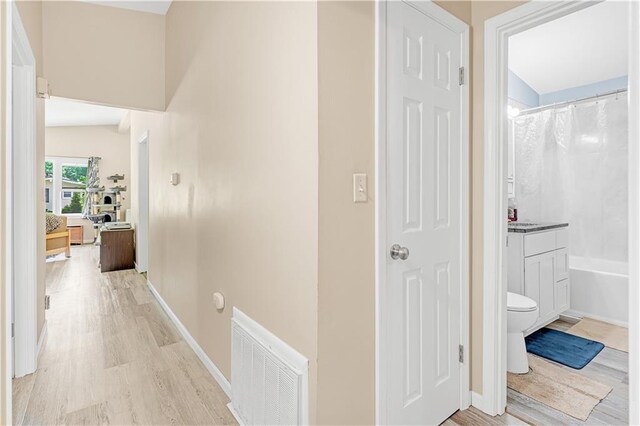 1112 Anderson St, Warrensburg, MO 64093 - hallway featuring light wood-type flooring and baseboards